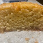 Gluten Free Lemon Loaf sitting on the counter on plastic wrap